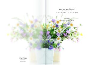 Programhefte med bilde av blomster i en potte på hvit bakgrunn
